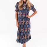 The Torian Ruffle Neck Midi Dress